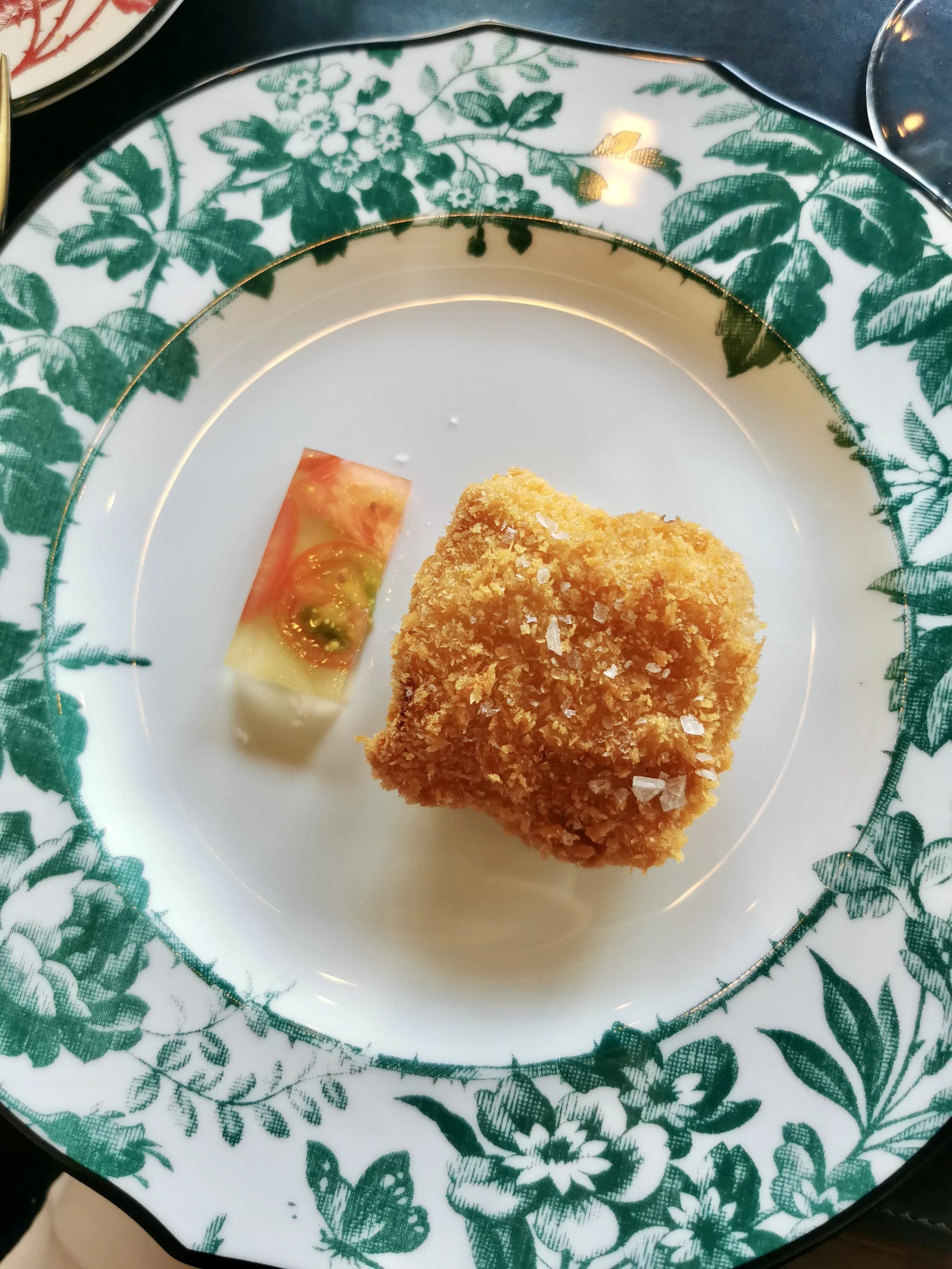 Gucci Osteria da Massimo Bottura signature dishes Cod Milanese & Little Gem, Calamari Grigliati, Spaghetto al Pesto di Santa Barbara, Emilia Burger.
